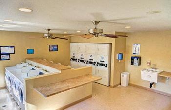 A laundry room with a washer and dryer stacked on top of each other.